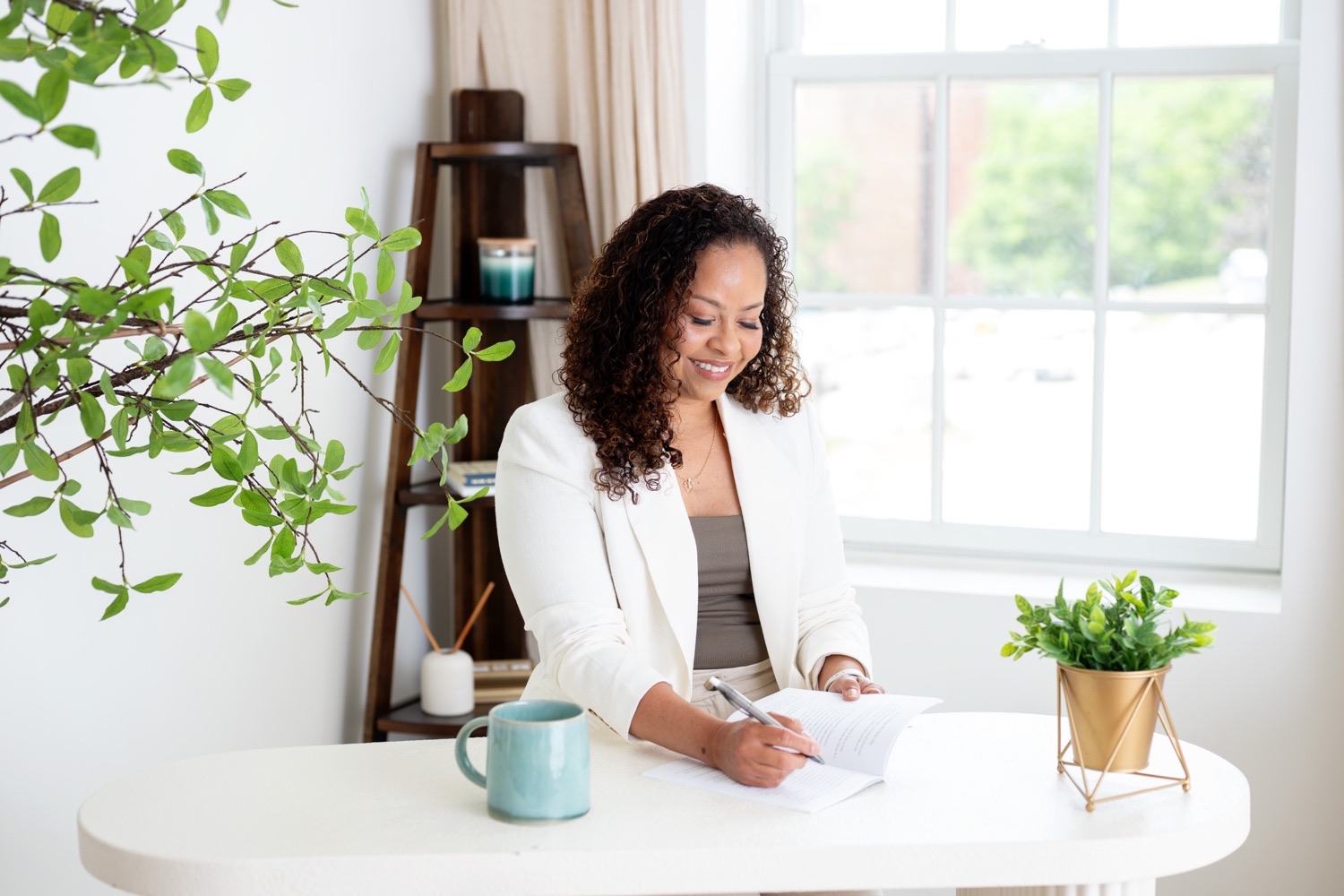 Melanie Leelook reviewing an HR plan at her desk